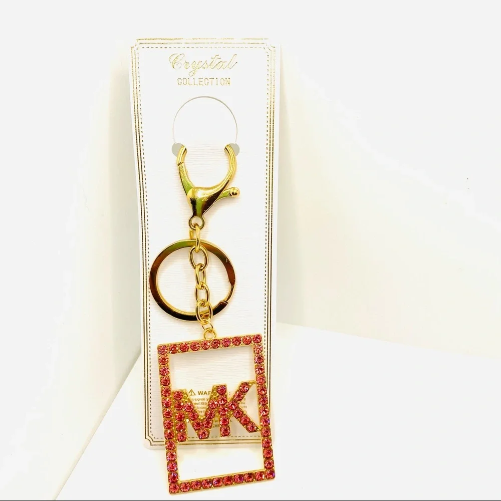 Purse Charm Key Chain MK Pink Crystals set in golden tone. BRAND NEW